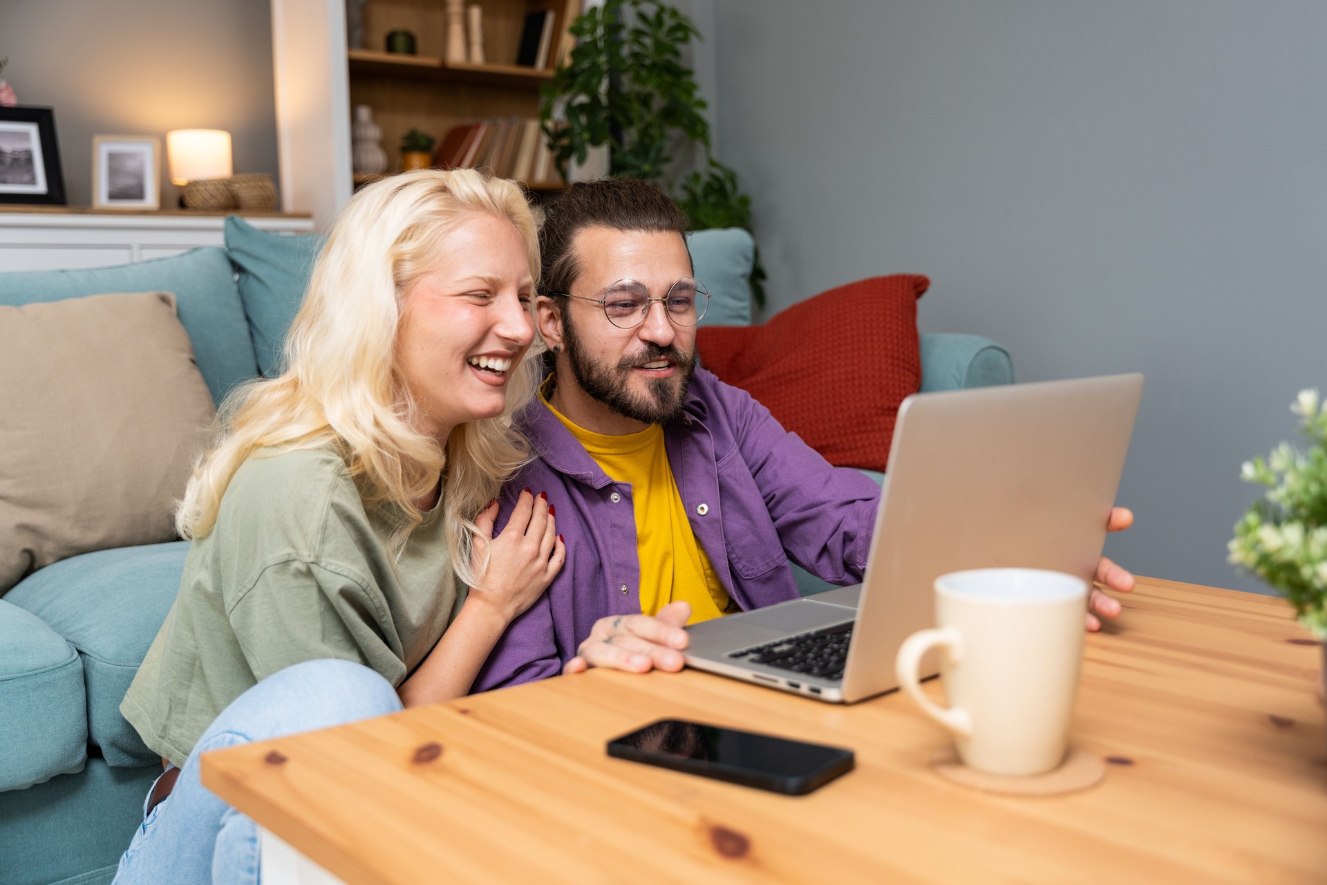 Young couple having video call from home with their psychotherapist, after online therapy for communication problems, relationship difficulties and marriage counseling to say thank you to her for help